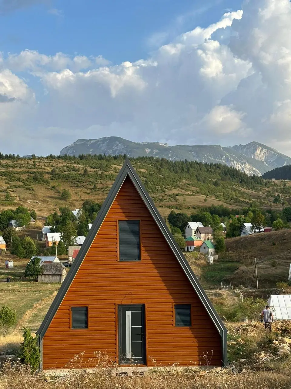 A-frame house with orange timber cladding