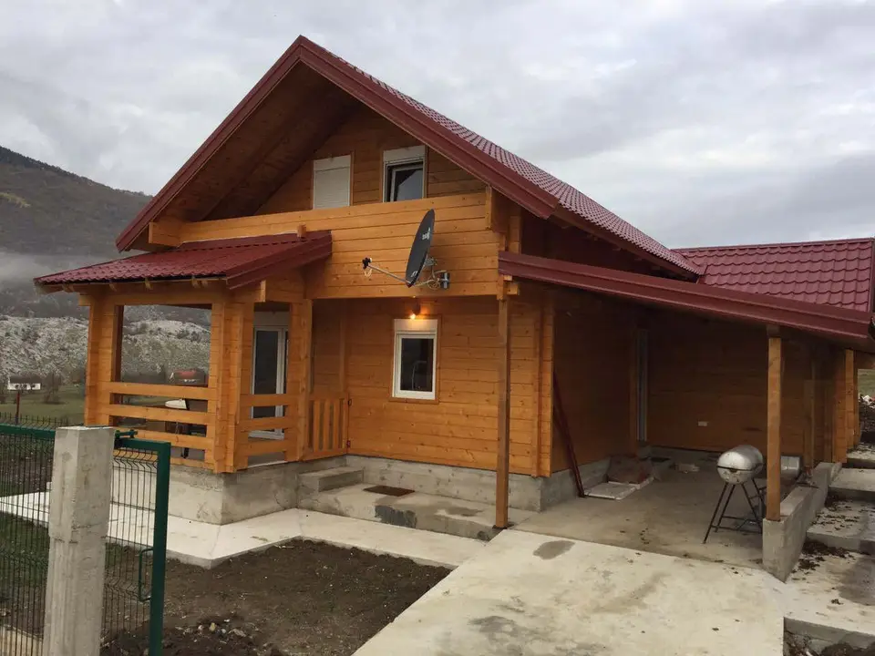 Log house with a red roof