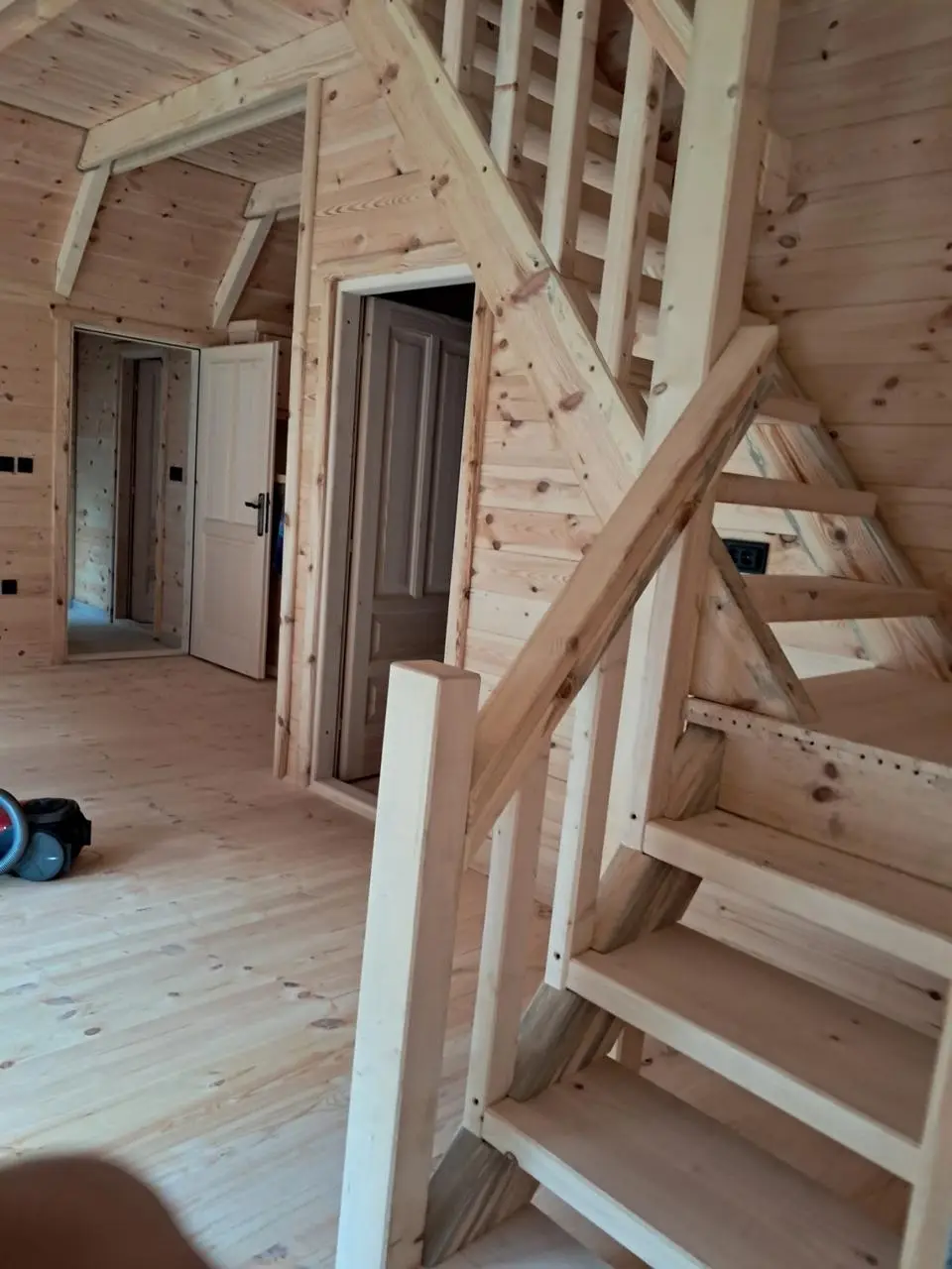 Wooden stairs to the attic of a prefab house during finishing works