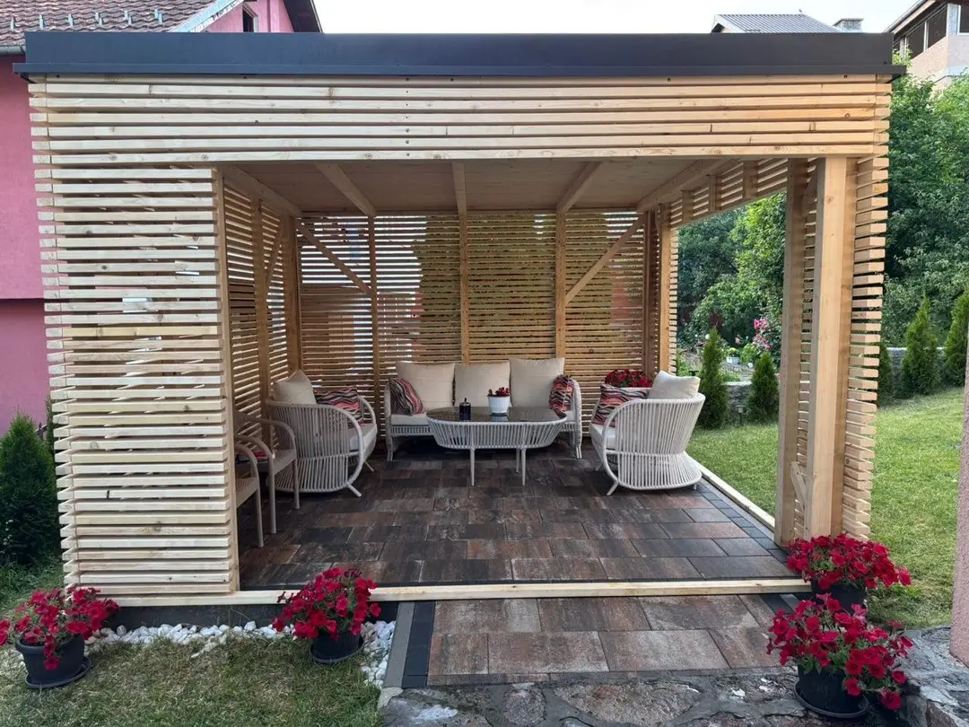 Wooden slatted pergola with garden furniture in a backyard