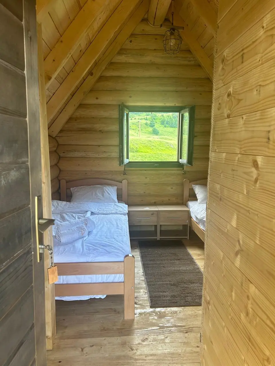 Bedroom in a log cabin with wooden beds